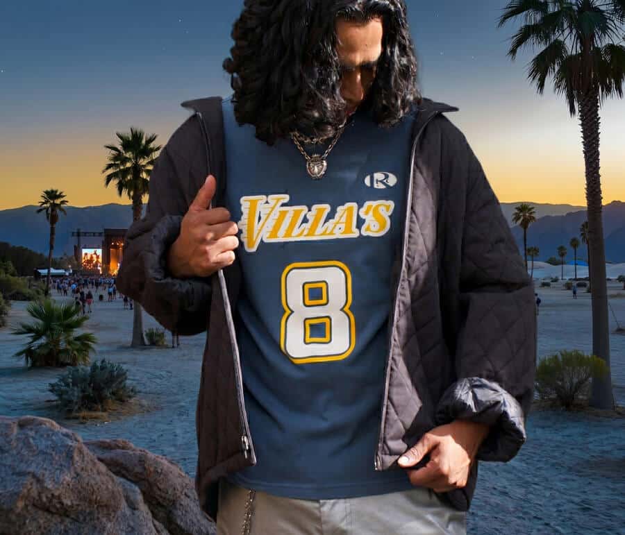 Blue Villa’s number 8 T-shirt worn under an open dark jacket