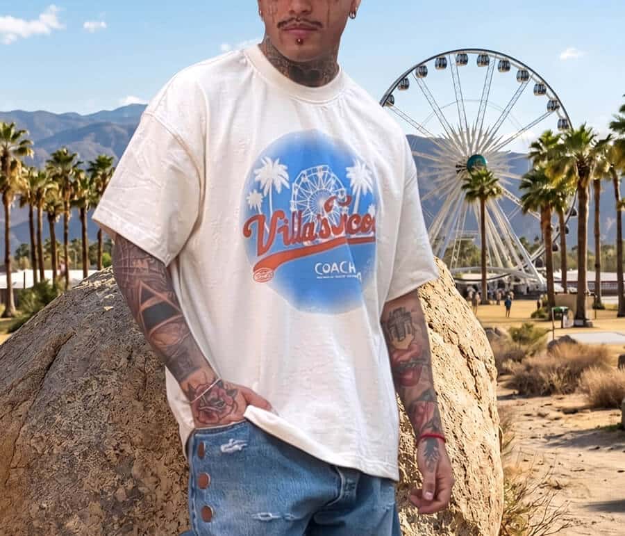 Cream Coachella souvenir T-shirt worn at a festival, front view